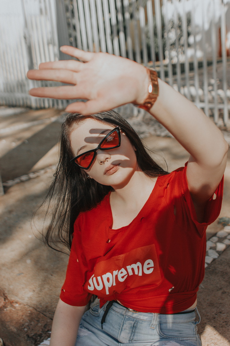 casual clothing, waist up, people, focus on foreground, red, outdoors, face, front view, photo, young women, nose piercing, sunglasses, female, lifestyle