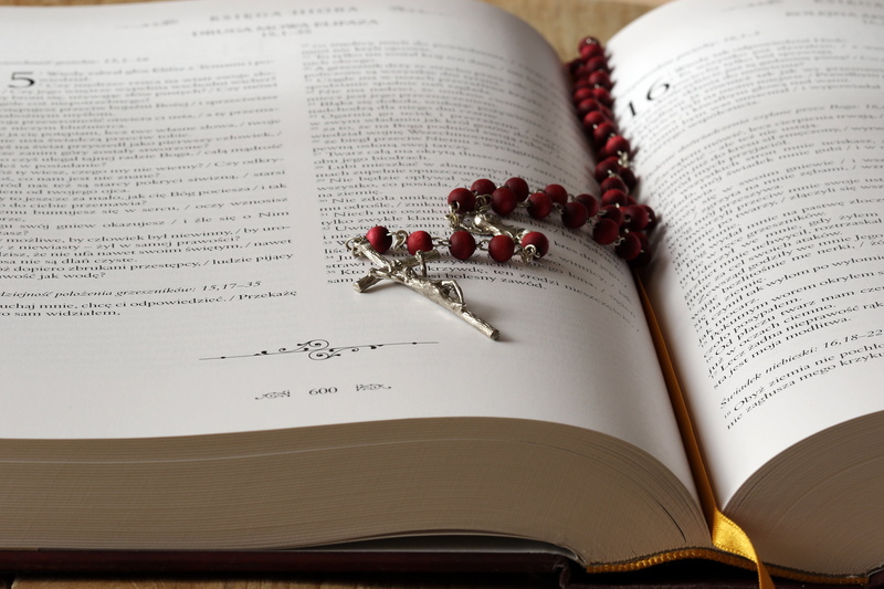 paper, church, beads, high angle view, selective focus, christianity, open, no people, religion, sacrament, rosary, learning, indoors, page, catholic, textbook
