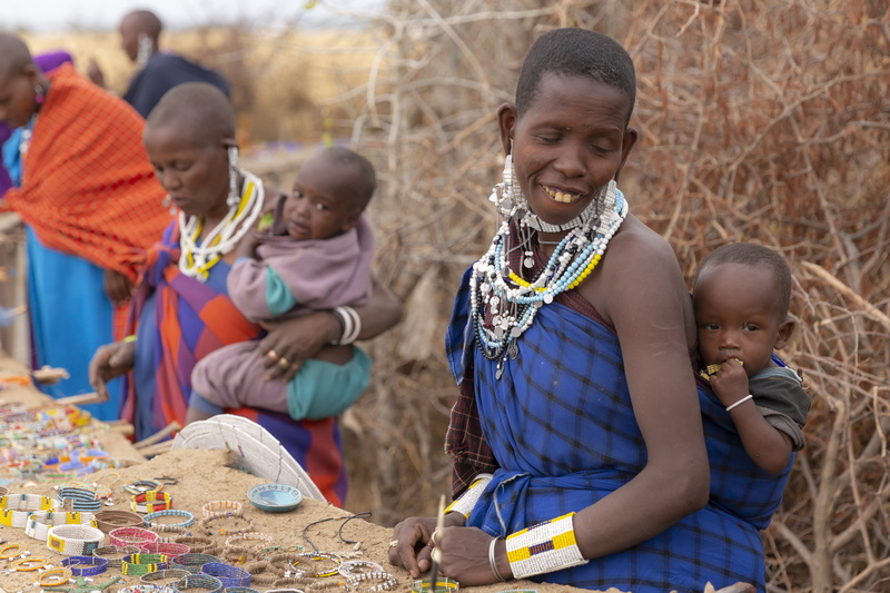 woman, person, togetherness, rosary, baby, finger, group of people, prayer beads, males, leisure activity, innocence, bead necklace, childhood, lifestyles