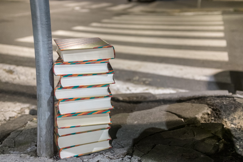 people, solid, garbage, needless, study, staircase, rock, publication, paper, waste, large group of objects, old, building, close-up, outdoors, book, sunlight