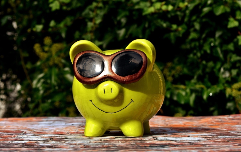 green color, outdoors, creativity, sculpture, close-up, security, sunglasses, day, ceramic, bank, wood - material, tree, representation, porcelain, money