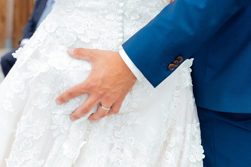 wearing, event, human body part, wedding ceremony, positive emotion, jewelry, clothing, gown, woman, midsection, wedding, dress, one person, love, wedding couple