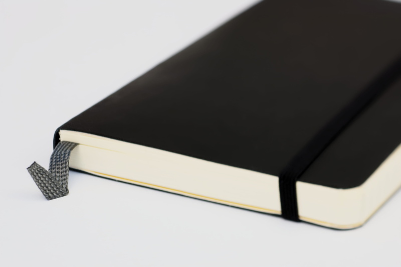 moleskine, education, isolated, book, close-up, black background, arts culture and entertainment, writing, indoors, writing instrument, message, business