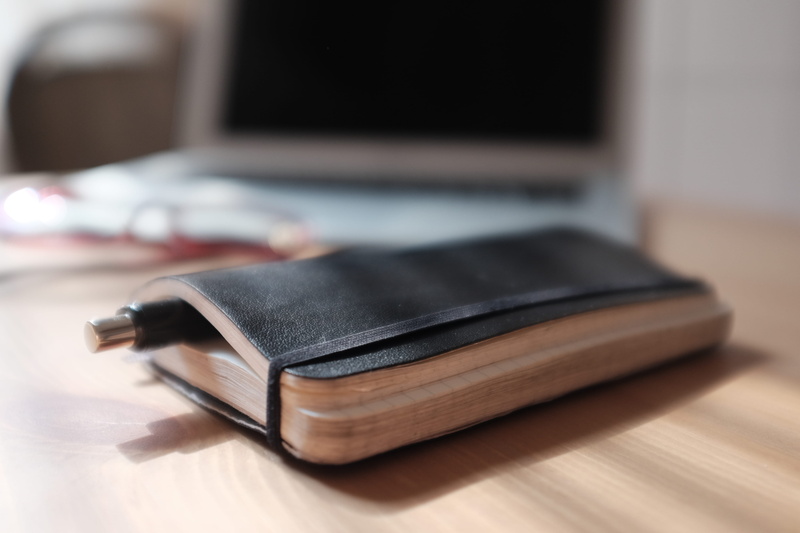 4K, personal accessory, focus on foreground, indoors, connection, close-up, diary, computer, absence, black color, communication, day, moleskine, leather