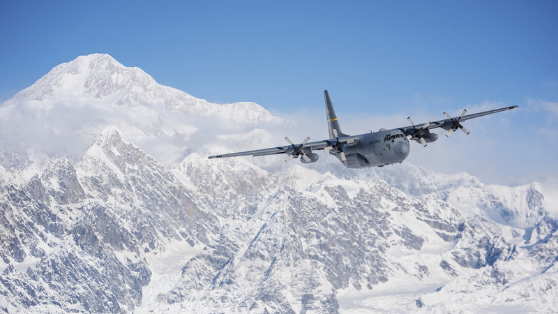 nature, outdoors, no people, mountain range, air vehicle, day, mountain, usaf, hercules, snowcapped mountain, sky, mid-air, mode of transportation, clear sky