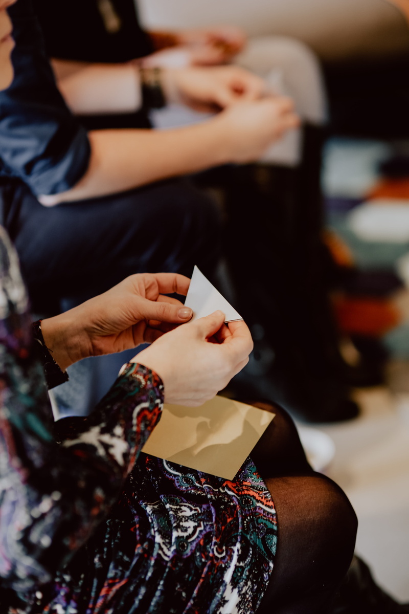 human hand, origami, workshop, finger, indoors, sitting, handmade, leisure activity, artwork, midsection, women, real people, japan, creative, craft, incidental people