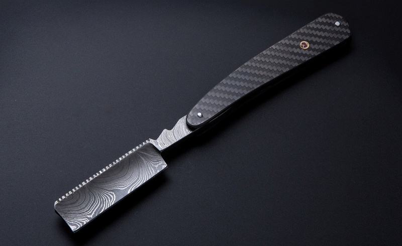 single object, black background, sharp, carbon fiber computer backgrounds, silver colored, indoors, no people, studio shot, work tool, still life, knife