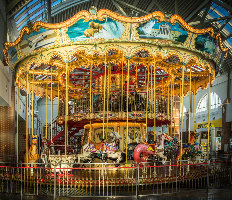 animal wildlife, entertainment, animal representation, carousel, outdoors, built structure, carnival, illuminated, carousel horses, amusement park, livestock