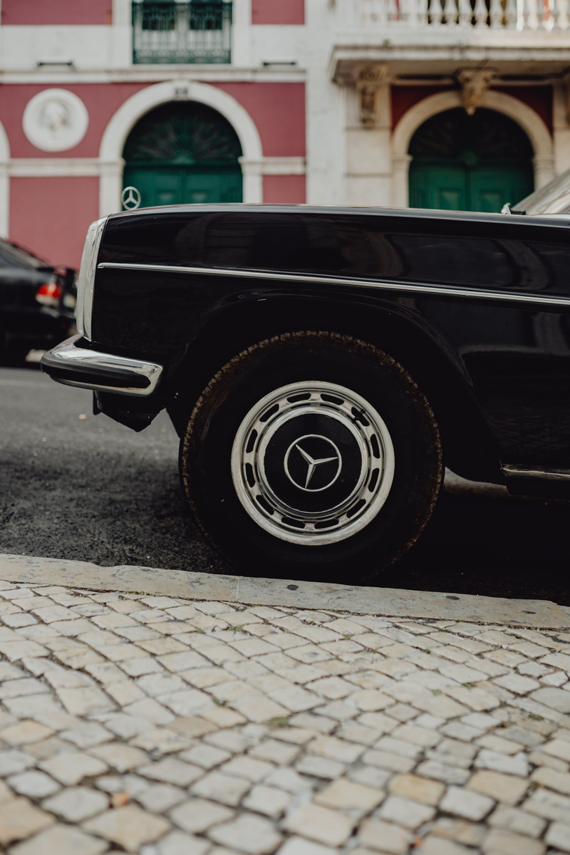 outdoors, black, street, portugal, portuguese, architecture, city, automobile, surface level, lisbon, wheel, tire, day, parking, motor vehicle, mercedes benz