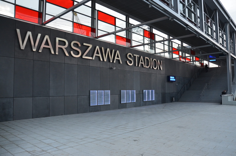 building exterior, arrow symbol, building, warning sign, station, the capital of the, text, national stadium, no people, city, railway station, stadion