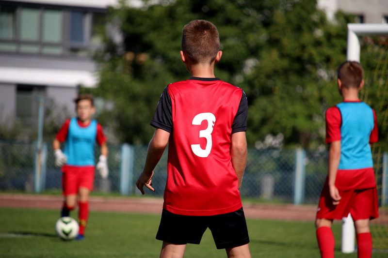 rear view, orlik, run, child, game, group of people, grass, team, team sport, activity, 2K, futbol, stadion, players, tournament, outdoors, soccer ball