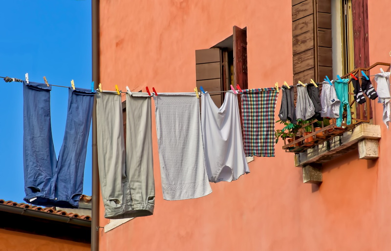 building exterior, window, wire, clothes line, urban, wall - building feature, nature, clothe, clothes, towel, wood, building, clothesline, shirt, sock