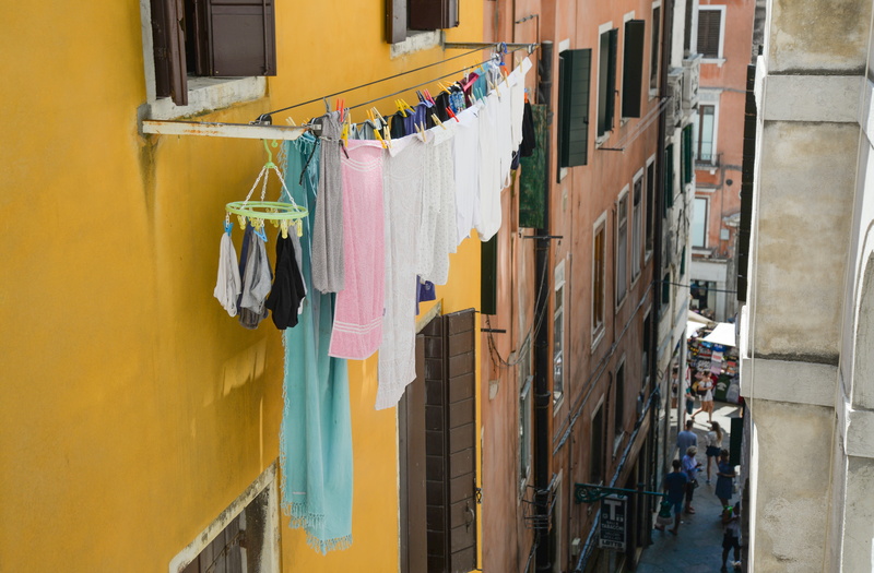 housework, building, dry, clothesline, building exterior, no people, street, residential district, built structure, cleaning, city, apartment, drying, outdoors