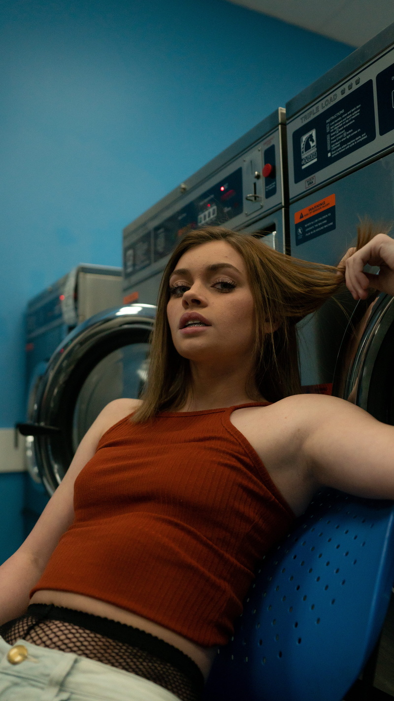 leisure activity, holding, one person, shop, blue, adult, mode of transportation, woman, casual clothing, indoors, laundromat, 5K, teenager, long hair