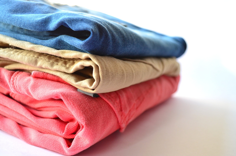 stack, studio shot, multi colored, towel, trousers, no people, red, softness, group of objects, fashion, folded, white background, indoors, pants, laundry