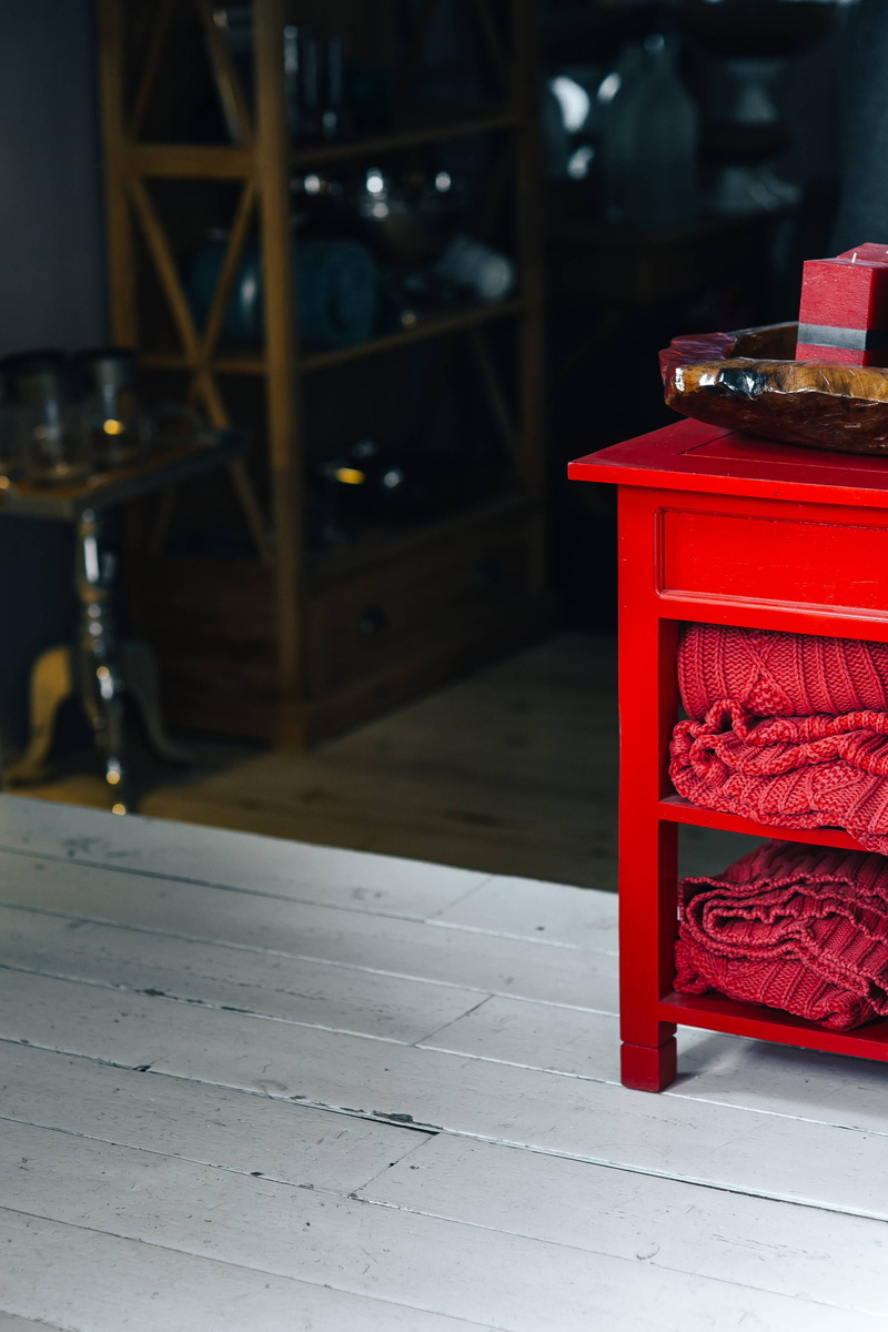 tiled floor, tile, fabrics, box - container, container, wool, shelves, rug, architecture, box, Folded, publication, woven, table, furniture, focus on foreground