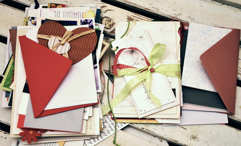 large group of objects, book, white, mail, day, penpal, publication, wood - material, box, education, correspondence, indoors, paper, high angle view, still life