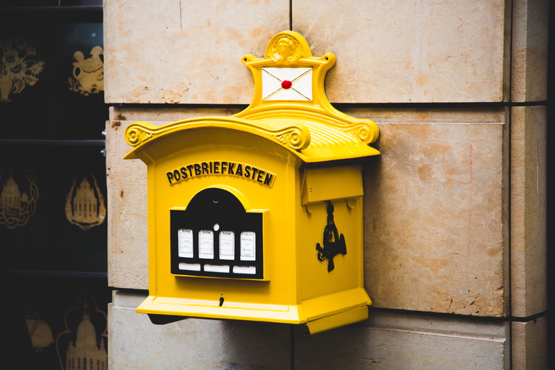 architecture, outdoors, telephone booth, wall, technology, brown, communication, close-up, built structure, focus on foreground, no people, telephone, retro styled