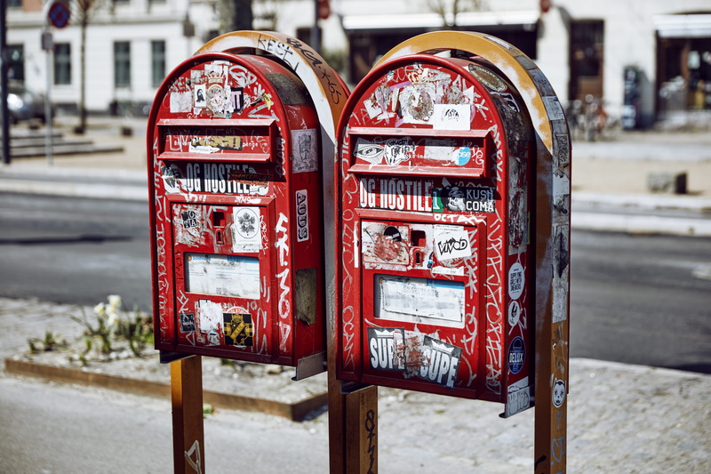 architecture, outdoors, focus on foreground, grafitti, road, city, street, copenhagen, close-up, urban, no people, letterbox, communication, 8K, boxes