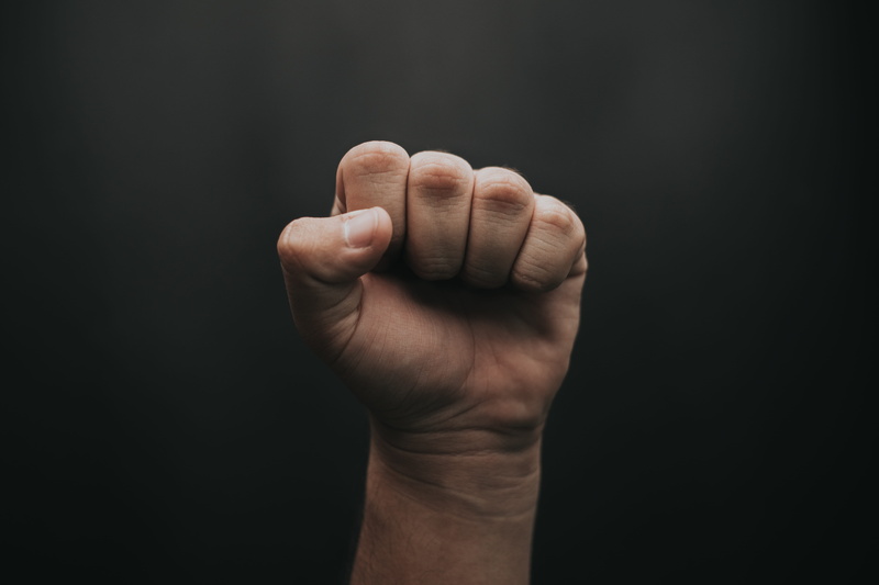 coin, hole, black background, plectrum, indoors, wrist, tartan, fist, nickel, body part, palm, aggression, key, plaid, musical instrument, ct scan, gesturing