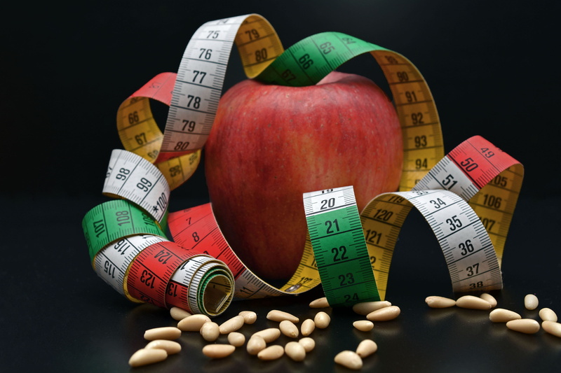 instrument of Measurement, number, no people, apple, finance, fruit and vegetables, slim, black background, western script, vitamins, multi colored, healthy