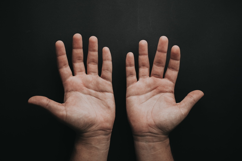 one person, black background, human body part, communication, photography, palm, human limb, human hand, right, hands, limb, indoors, left, body part, hand