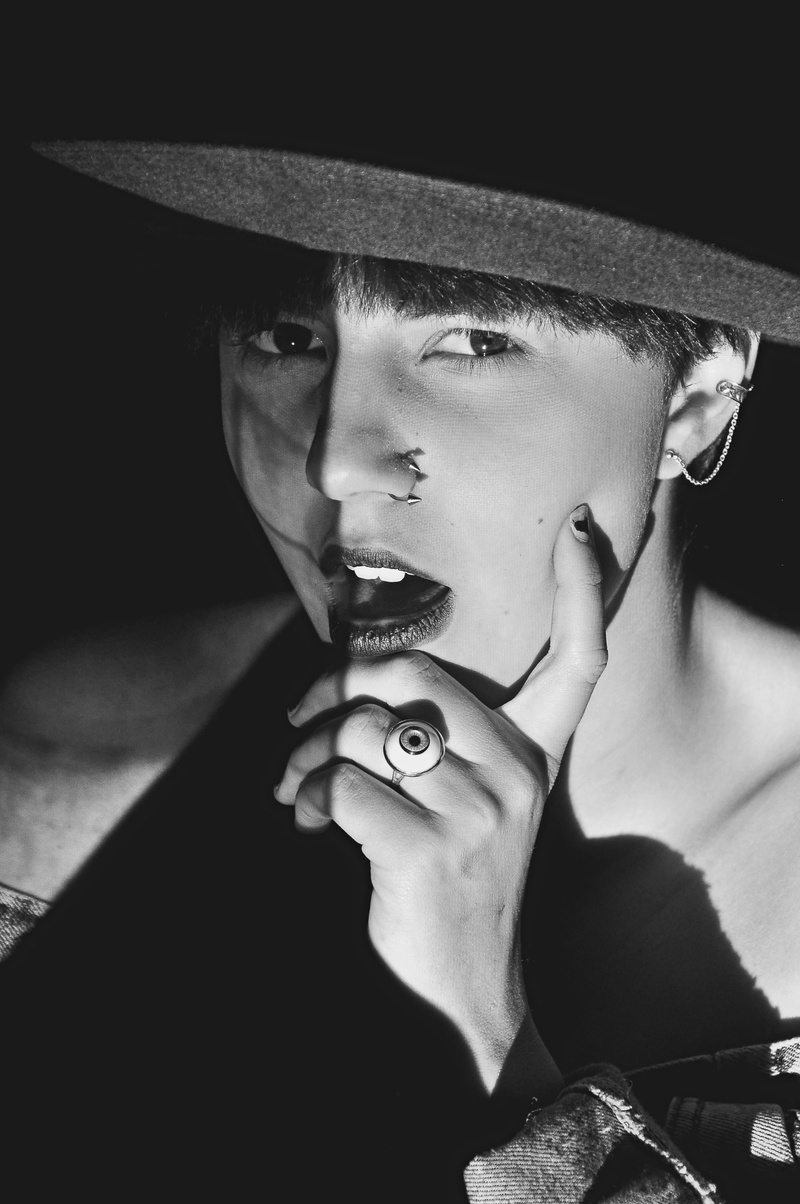 human, holding, cowboy hat, animal, leisure activity, finger, musical instrument, mouth, 4K, contact lens, cricket insect, front view, real people, smoke