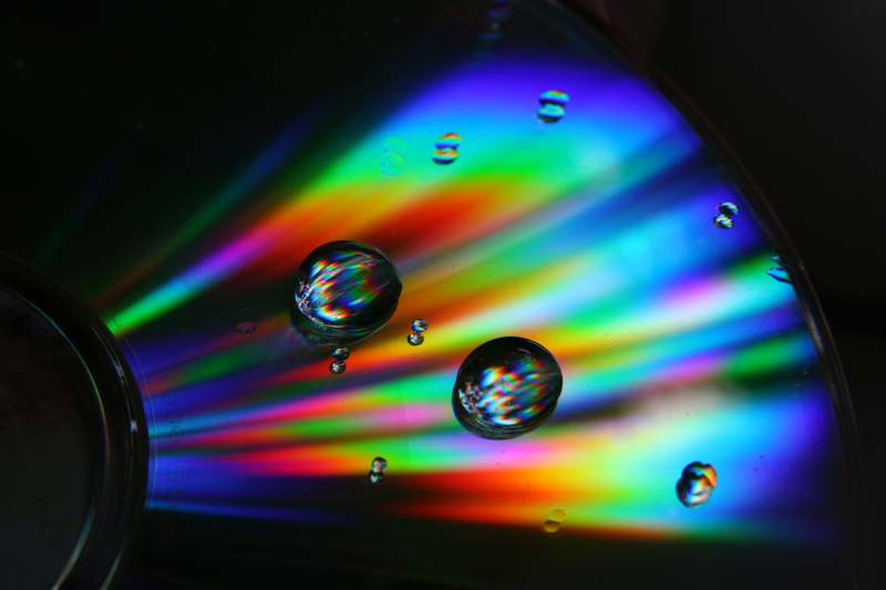 storage, illuminated, reflection, close-up, sphere, cd-rom, no people, backgrounds, disco ball, indoors, bubble, optical, disco lights, rainbow, motion