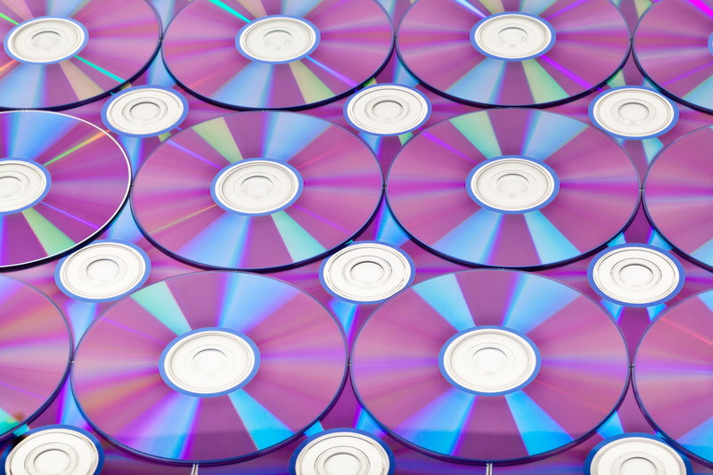 background, disk, storage, the media, studio shot, shape, optical, close-up, 2K, multi colored, indoors, dvd, symbol, pattern, copy, geometric shape, blu-ray