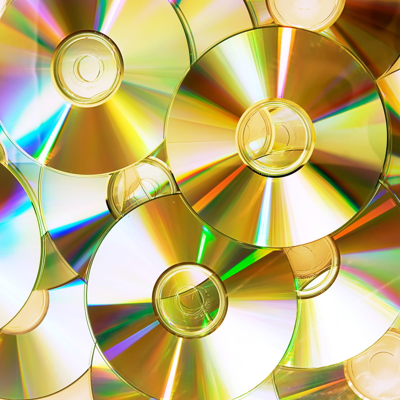 full frame, plastic, cd-rom, recordable, no people, storage, industry, data, technology, science, backgrounds, stack, reflection, close-up, object, shiny