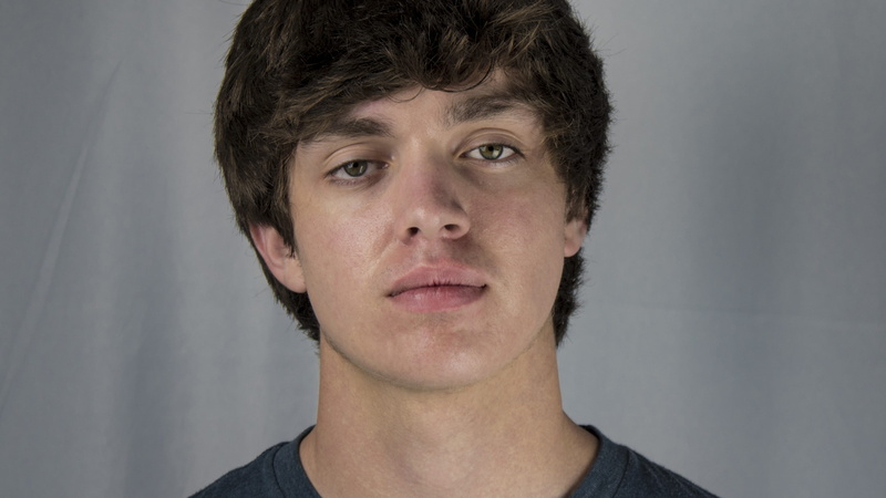 doubtful, uncertainty, studio, young adult, gray, close-up, 4K, brown hair, gray background, headshot, black, looking at camera, skeptical, question, front view