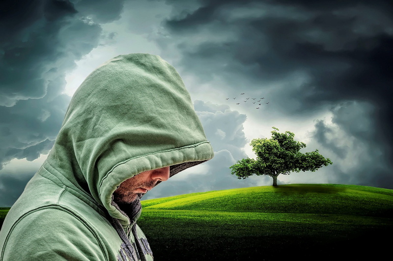 emotion, jumper, lonely, real people, field, background, hood, beauty in nature, cloud - sky, lifestyles, clouds, outdoors, tree, standing, hide, mourning