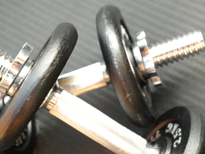 gray, focus on foreground, fitness studio, silver colored, equipment, high angle view, group of objects, selective focus, weight lifting, small group of objects