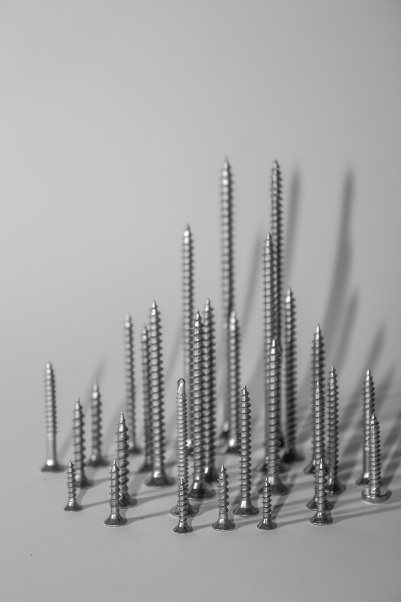 indoors, hook, pattern, machine, white background, wall clock, alloy, gray, selective focus, vending machine, animal, electronics, engine, in a row, bolt