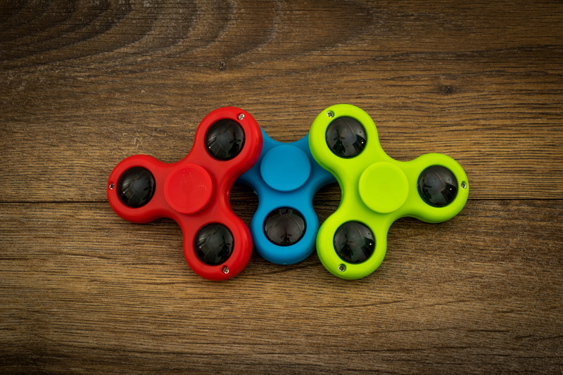 rotating, group of objects, still life, anti anxiety, toys, directly above, relaxation, wood - material, speed, spin, stress, variation, rotation, play