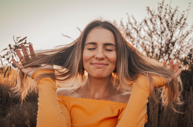 woman, creativity, headshot, human arm, lifestyles, brown, beautiful woman, person, style, happy, eyes closed, hand, making, contemplation, smile, yellow
