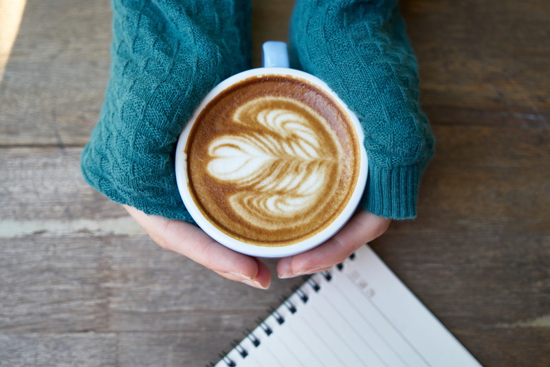 macro, espresso, holding, hot drink, latte, notebook, real people, beautiful, high angle view, wood - material, coffee cup, 5K, drink, table, cafe, brown