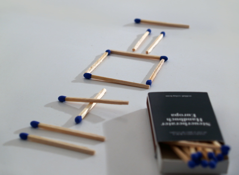 close-up, wood - material, problem, group of objects, text, selective focus, still life, riddle, matchstick, brainstorming, matches, logical, indoors, table