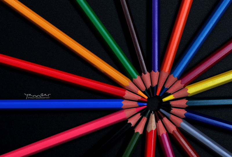 geometric shape, arrangement, order, art and craft equipment, directly above, variation, writing instrument, colored pencils, close-up, black background