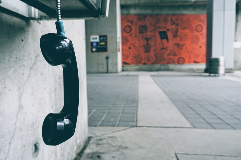 communication, toronto, focus on foreground, wall - building feature, bell, air canada centre, technology, alley, phonebooth, flooring, silver colored