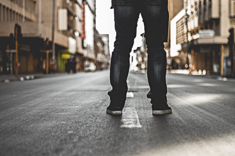 person, feet, human leg, transportation, black, urban, architecture, challenge, street, built structure, alone, jeans, real people, one person, casual clothing
