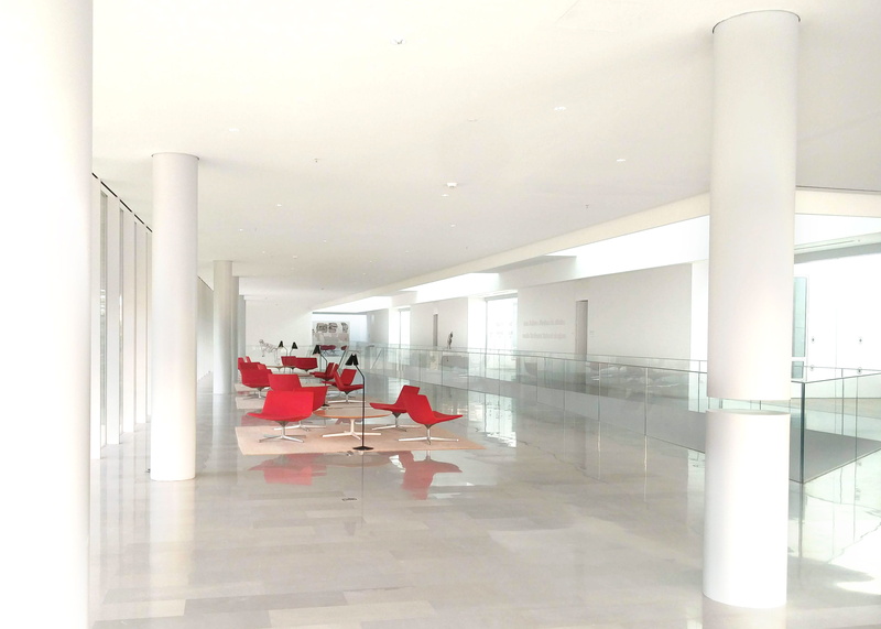 lighting equipment, building, broken column, seat, red chairs, interior, illuminated, ceiling, red, glossy floor, tiled floor, airport, reflection, flooring