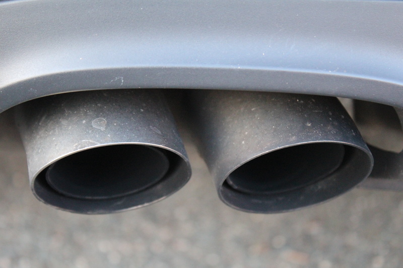 studio shot, exhaust, exhaust gases, focus on foreground, aluminum, gray, pollution, silver colored, shape, alloy, circle, extreme close-up, auto, vehicle