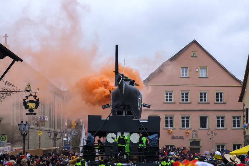 crowd, helicopter, large group of people, parade, fools, nature, incidental people, adult, architecture, weapon, pollution, carnival, steam, cloud - sky