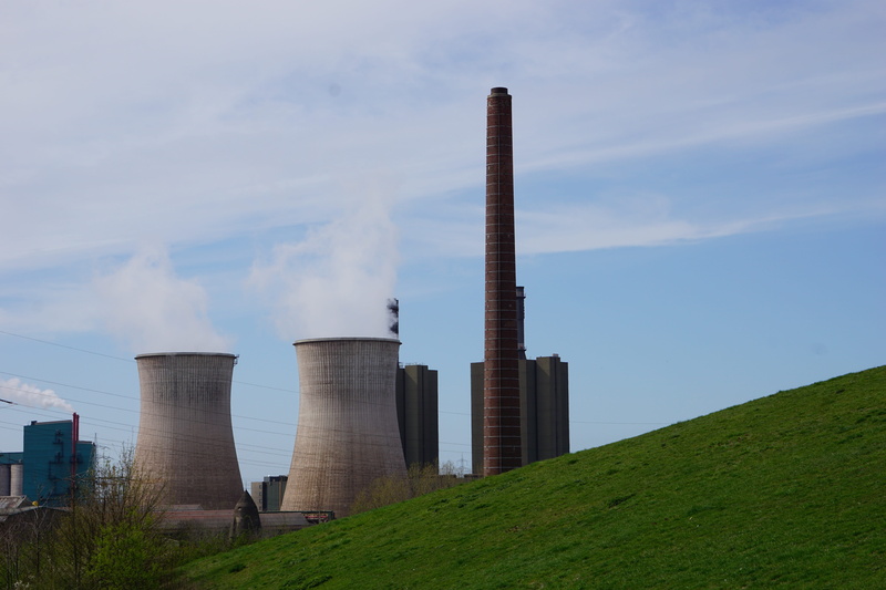 smoke, built structure, environment, building exterior, cloud - sky, plant, smoke stack, cooling tower, fuel and power generation, architecture, industrial park