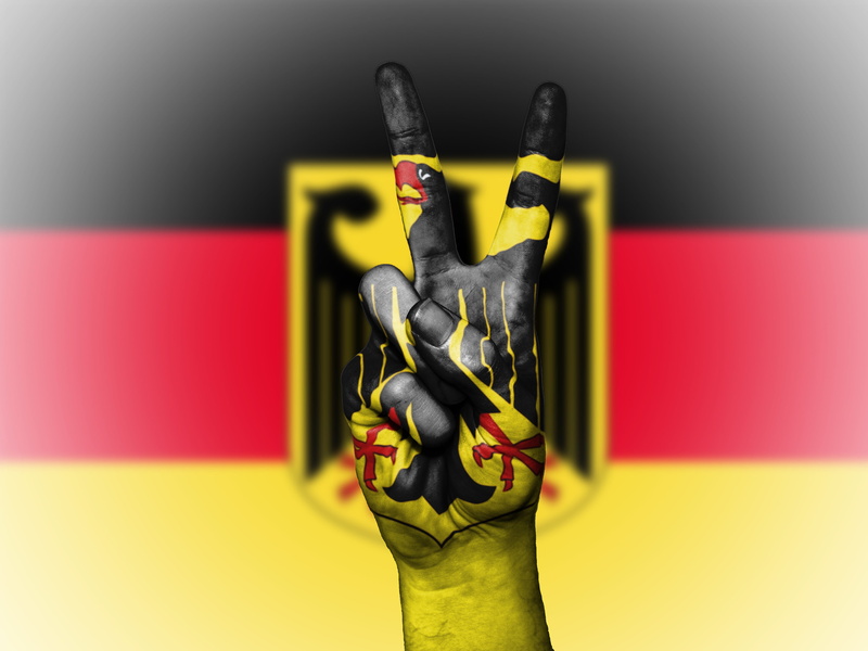close-up, sport, black color, achievement, people, patriotism, symbol, human hand, tourism, finger, indoors, graphic, craft, ensign, icon, human body part