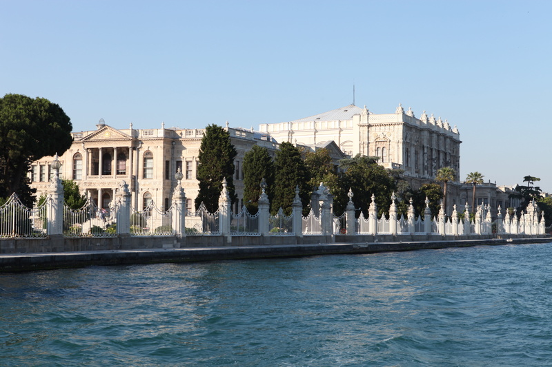 clear sky, city, palace, day, turkey, the past, building exterior, blue, plant, travel destinations, dolmabahce palace, built structure, luxury, outdoors