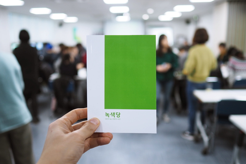 indoors, hand, advertisement, technology, human hand, human, men, brochure, room, body part, classroom, person, real people, cafeteria, human limb, crowd