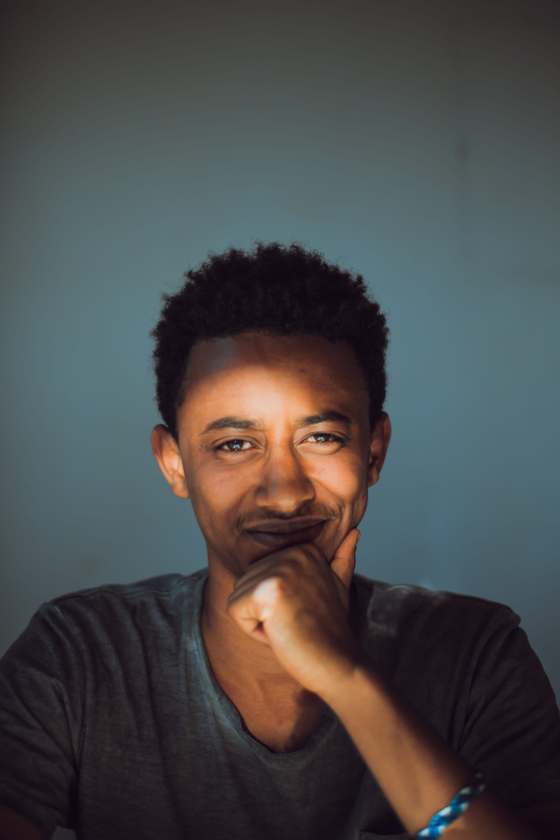 portrait, headshot, casual clothing, 5K, sunshine, face, performer, smiling, photography, sun, ethiopia, contemplation, cool, person, t-shirt, smiley face