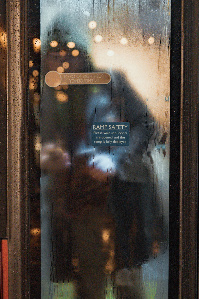art, glass, safe, information, reflection, entrance, drink, tool, western script, book, human, liquor, person, sign, transparent, window, beverage, advertisement